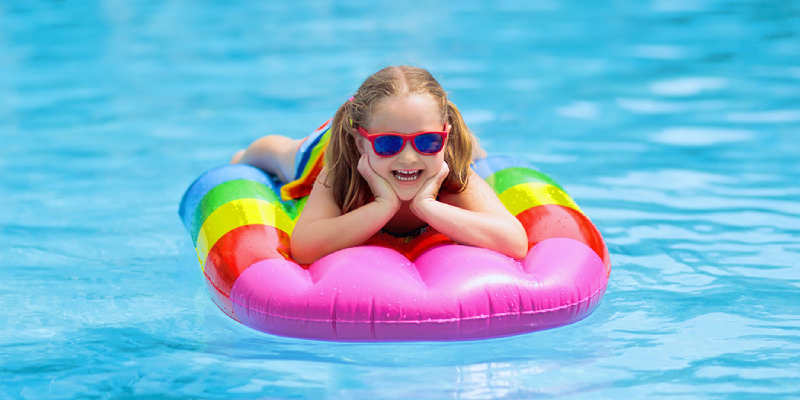 Young female traveller poses sitting around swimming pool with food Stock  Photo by fxquadro